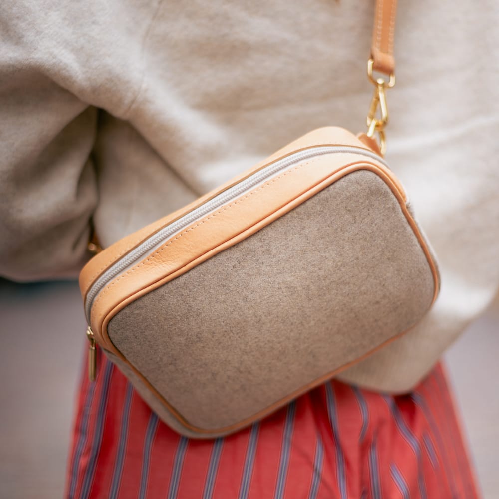 Close-up of the Natural Italian Wool Crossbody Bag worn across the body